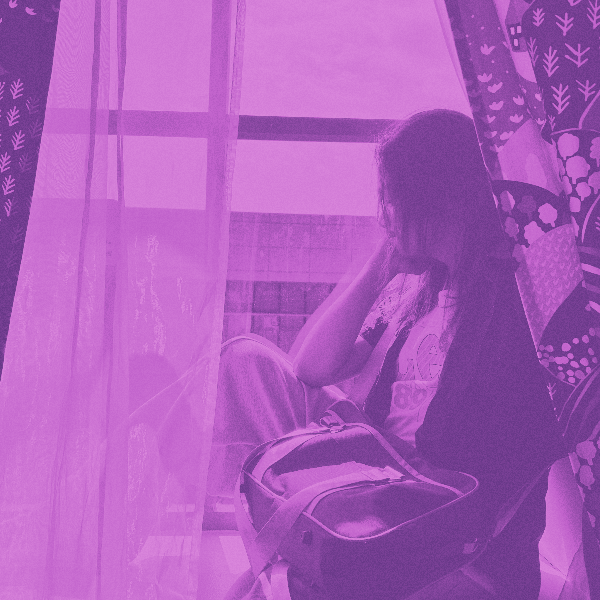 Sean Calaoagan sitting by a window